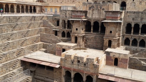 Ornate carvings adorn every pillar and statue around the well