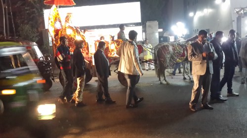 The groom arrives in a horse drawn carriage