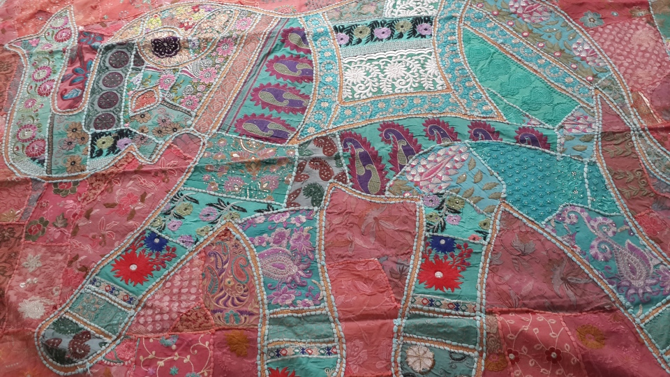 Exuberant patchwork, handloom fabrics, carvings and nature paintings