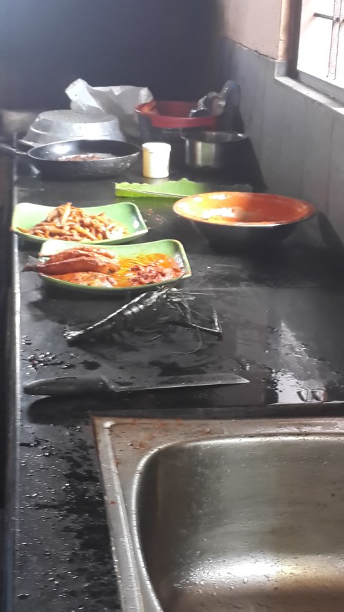 Fish await a fiery fry. Pearl spot, prawn and anchovies fried.